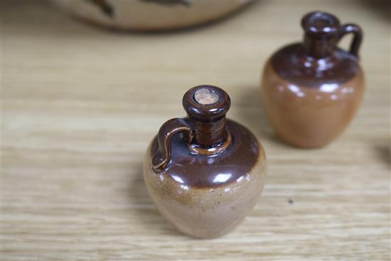 A pair of Doulton Lambeth stoneware jardinieres, three jugs and a tyg